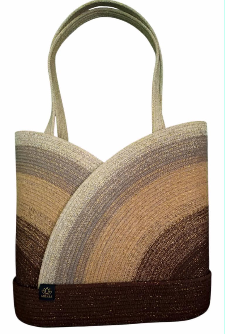 Woven tote bag with ombre striped pattern transitioning from cream to tan to dark brown