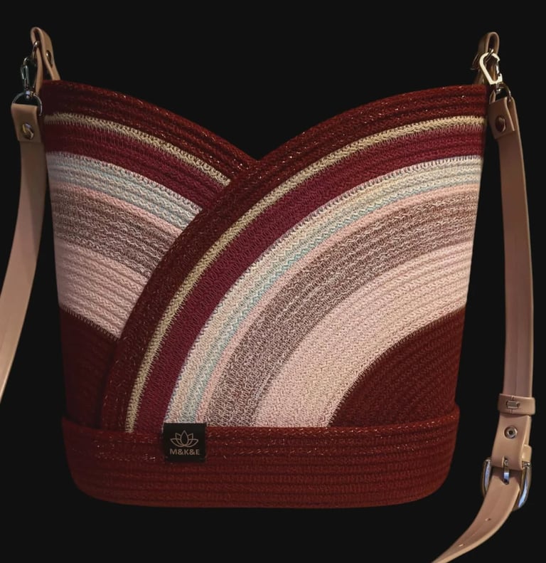 Burgundy and cream striped shoulder bag with tan leather straps and metal hardware